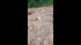 A sudden flash flood struck, causing landslides, and isolating a village in Vietnam