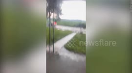 Dramatic footage shows huge tornado twisting across fields