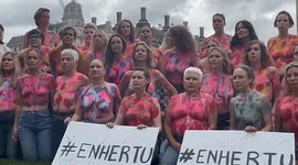 Women go topless for breast cancer ouside British parliament