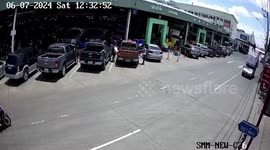 Cargo tumbles from overloaded pickup truck at market
