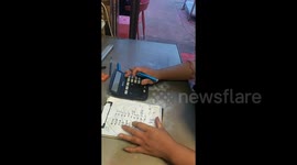 Chinese restaurant owner wows customers with lightning-fast calculator skills