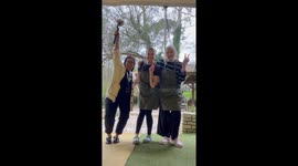Joyful reactions captured as woman surprises friends with pregnancy announcement