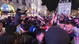 England fans celebrate the win over the Netherlands by taking over the streets of Piccadilly Circus. Stopping buses and other vehicles from moving on as fans surrounded them