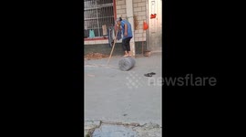 Chinese woman, 82, balances on stone roller to expertly craft traditional mats