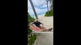 Hammock adds laughter to a couple's 35th anniversary in the Maldives