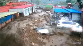 Terrifying flash flood engulfs village, sweeping away vehicles in northern China
