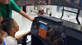 China: Children Experience A Virtual Low-altitude Flying Game at the 2024 WAIC in Shanghai