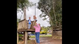 Mother holds on: pants down, laughter up