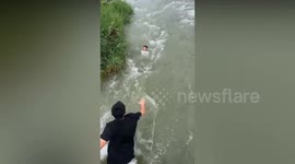 Heroic man risks life jumping from bridge to save drowning child in raging river