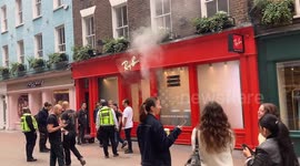 Smoke cascades into Carnaby Street, central London