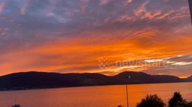 An orange firesky sunset over Loch Long in Argyll on the West Coast of Scotland