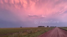 Minnesota man on his nightly drive chasing sunsets catches some awesome pink clouds during the sunset and a storm