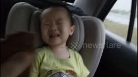 Adorable boy refuses to give up his favorite cookie even while he's asleep