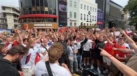 Street musician sings with England football fans ahead of the euros final against Spain