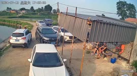 Driverless three-wheeler pushes fisherman into pond in China