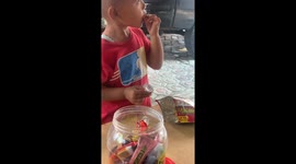 Kid Dips Fries In Closed Sauce Cup