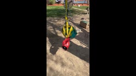 Genius dad uses leaf blower to push daughter around on swing