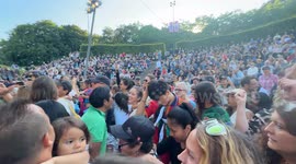 Big crowd dances cumbia in the live show of Los Mirlos from Peru at Malmö Sommarscen, Sweden.