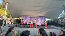 Big crowd dances cumbia in the live show of Los Mirlos from Peru at Malmö Sommarscen, Sweden.