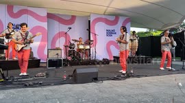 Big crowd dances cumbia in the live show of Los Mirlos from Peru at Malmö Sommarscen, Sweden.