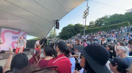 Big crowd dances cumbia in the live show of Los Mirlos from Peru at Malmö Sommarscen, Sweden.