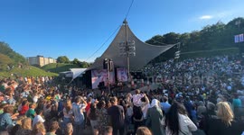 Big crowd dances cumbia in the live show of Los Mirlos from Peru at Malmö Sommarscen, Sweden.