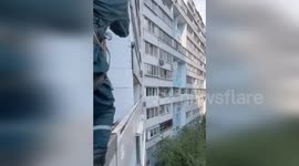 Firemen rescue dog stranded on balcony for two days in Moscow