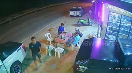 Speeding pickup truck crashes narrowly missing friends sitting outside shop