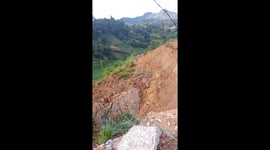 The moment the landslide occurred, the house on the hillside was destroyed