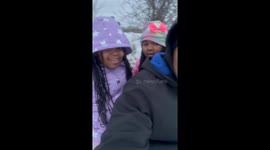 Kid Holds on Tight to Sled
