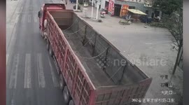 Child on electric bike flings himself onto road to avoid being crushed by lorry
