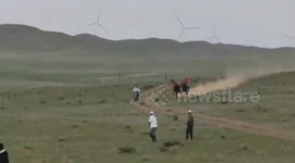 Galloping Mongolian horse riders hit people in crowd and send them flying