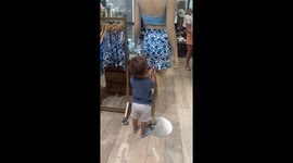 Child plays with mannequin in West Sacramento store