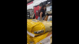 Child gets stuck between grain sacks while retrieving toy