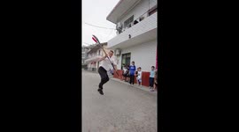 Villagers train children in martial arts during summer vacation