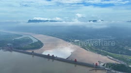 Dam in central China opens floodgates to manage rising water levels
