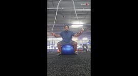 Man displays his dedication while jump-roping on a stability ball