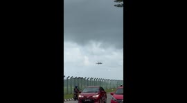 Pilot makes skilful landing while plane is blown by high winds in Malaysia