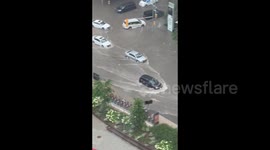 Canada: Motorists Drive Through Flooded Toronto Streets