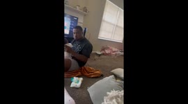 Dad can't help but laugh after baby throws up on his face