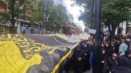 Thousands of Shia muslims carry enormous banner in London to mark Ashura Day
