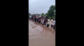 Incredible moment villagers made human chain to rescue students trapped in flooding in India