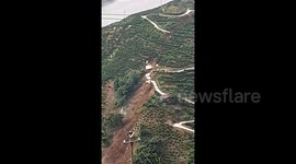 Devastating landslide hits Chinese village, damaging roads and fields