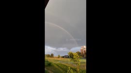 Double rainbow and lightning bolt seen at same time