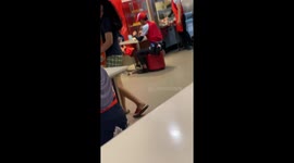 Fast food worker helps disabled customer to eat his burger and fries