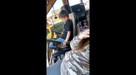 Funny backyard moment: Boy falls out of chair while relaxing with mom