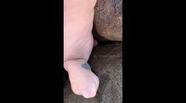 Shoe rescued from rocks and thrown cack into sea