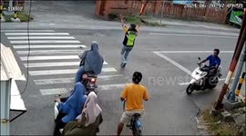 Motorbike and bicycle collision at Mojokerto intersection