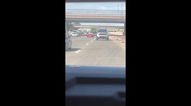 Car Drives With Sun Shield Up On California Freeway