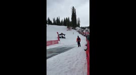 Snowboarder with no shirt dressed like a viking hits a pond skim and slams on his face and scorpions
